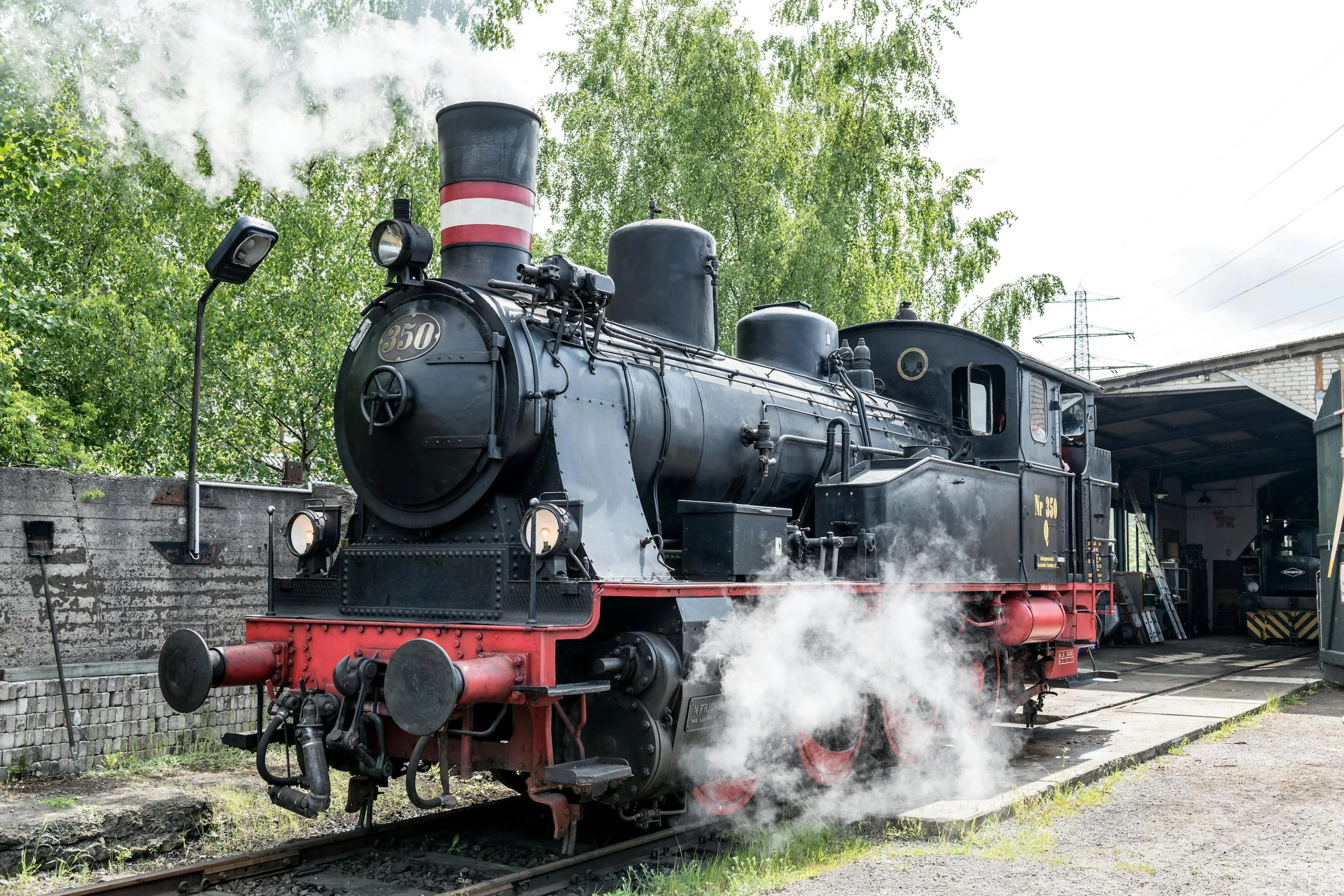 Historic steam locomotive in Geesthacht railway museum, showcasing vintage engineering.