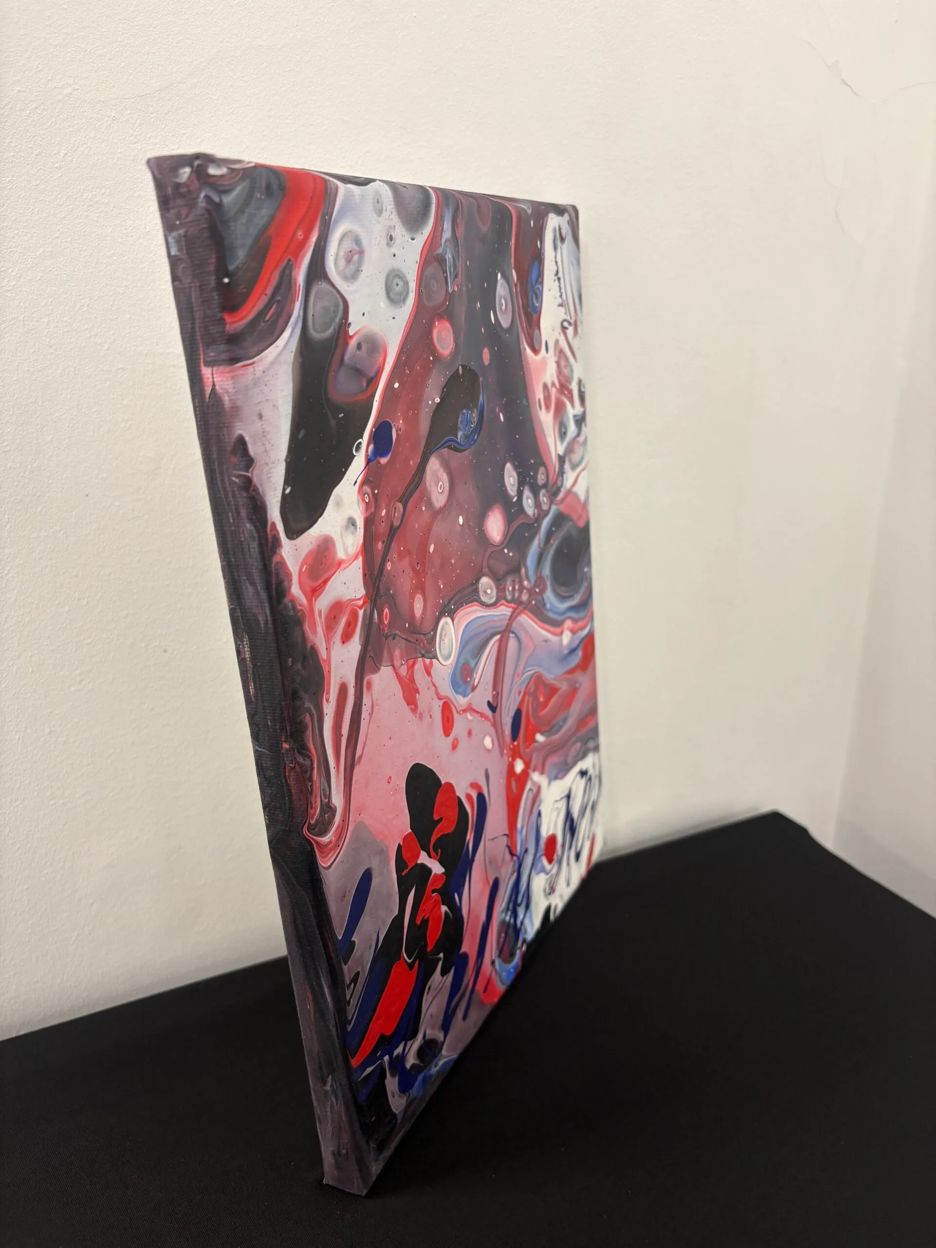 Red and Black Swirling Pattern Painting on Canvas by Jan